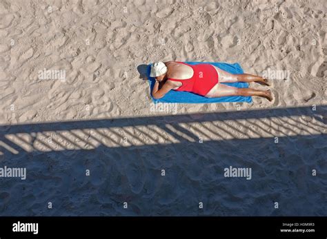 nude beach matures|Mature women sunbathing beach Stock Photos and Images.